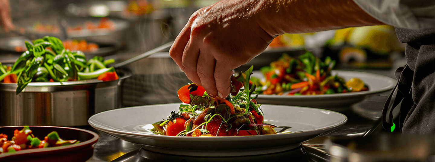 Hospitality frontline workforce chef plating restaurant kitchen